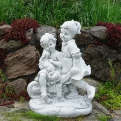 Gartendekoparadies Enfants & Anges-Garçon et fille avec brouette